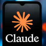 Anthropic's Claude AI logo is shown on a smartphone display against a blue blurred background with orange and red lights