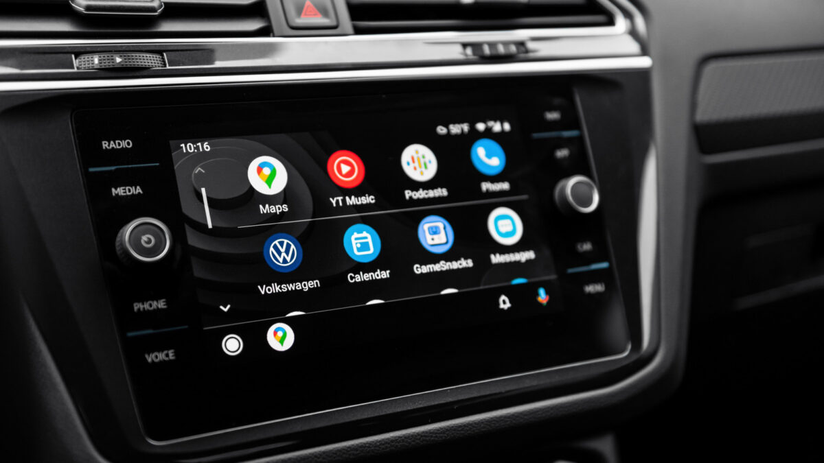 A car's display shows Android Auto.