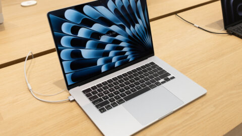 A MacBook plugged into a charger