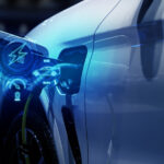EV at a charging station with charging graphics overlaying the picture in neon blue.